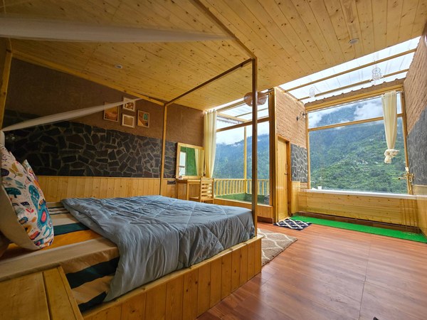 Bed beside the glass wall