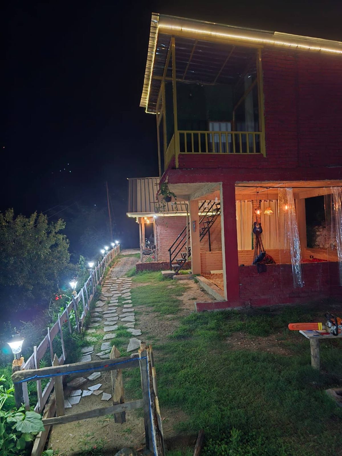 The Glass House glowing after dark